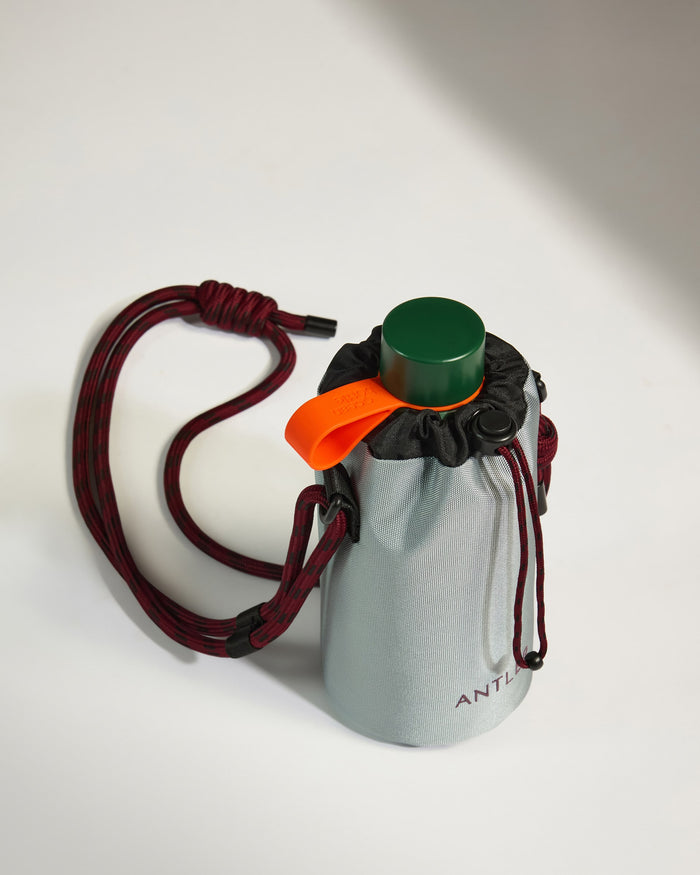 a water bottle with a green cap