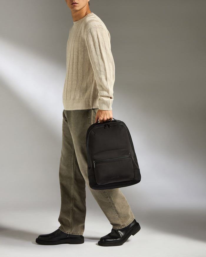 a man walking with a backpack