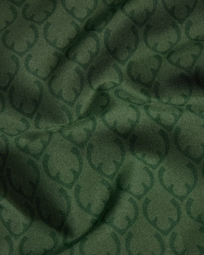a green fabric with a pattern