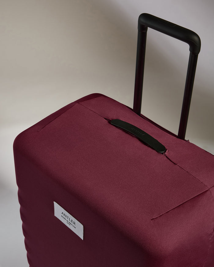 a red suitcase with handle