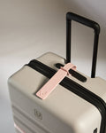 a luggage bag with a tag on it