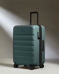 a blue suitcase with wheels