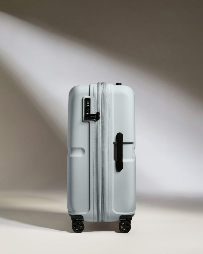 a suitcase with wheels and handle