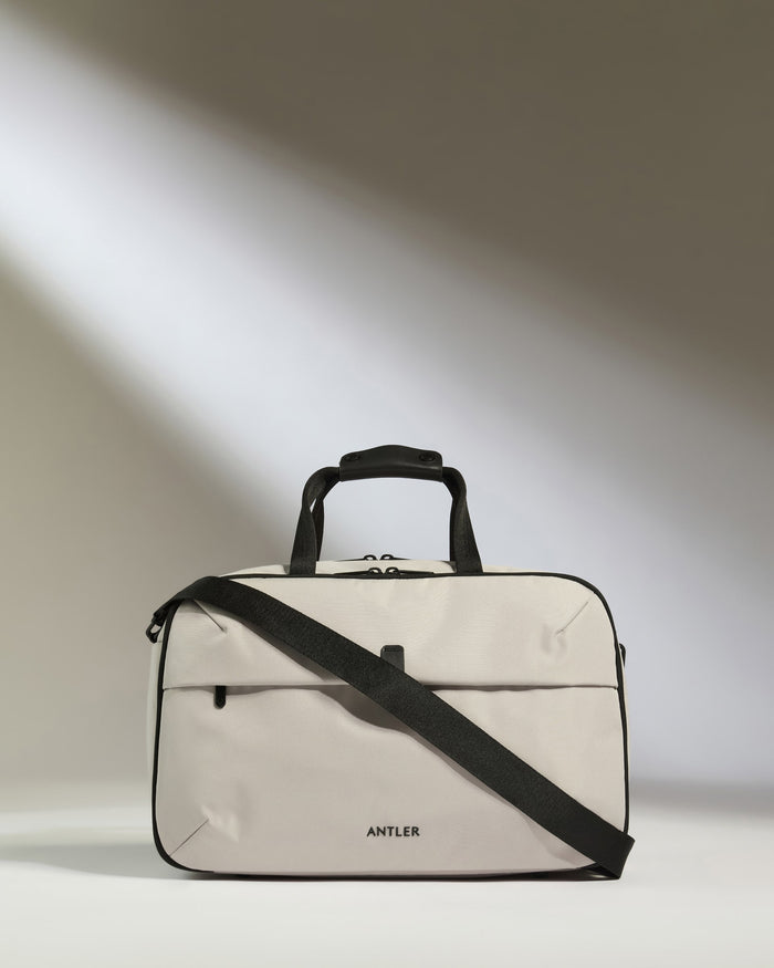 a white bag with black straps