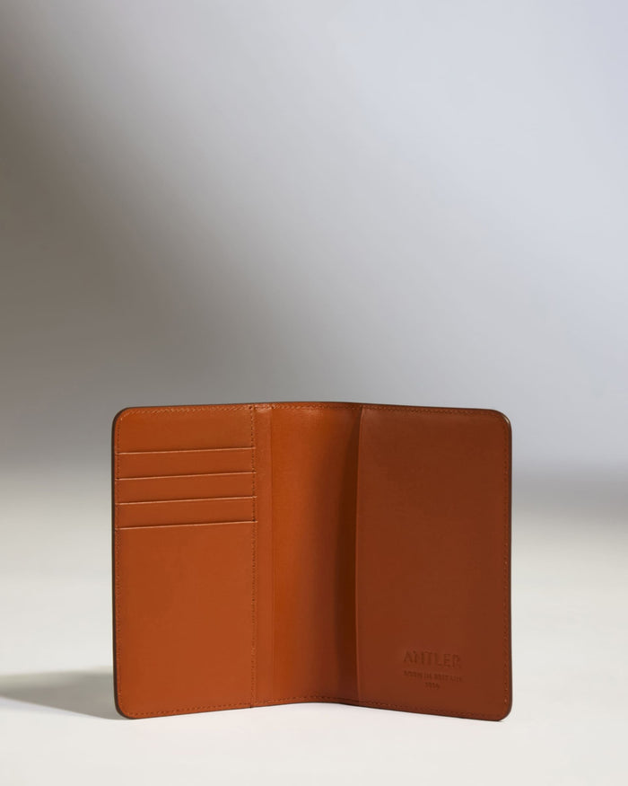 a brown wallet with a white background
